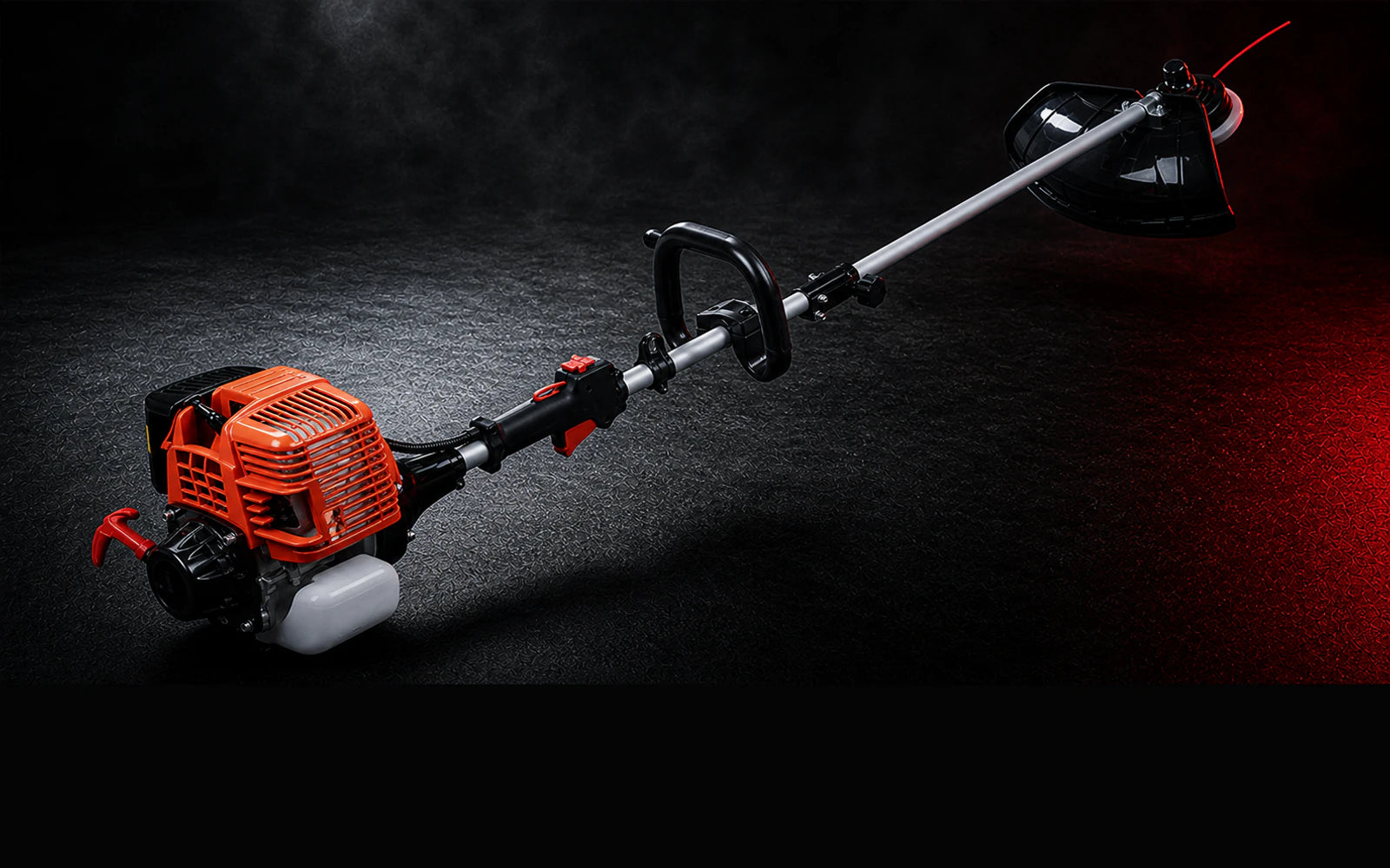 Petrol garden trimmer in black and red lighting