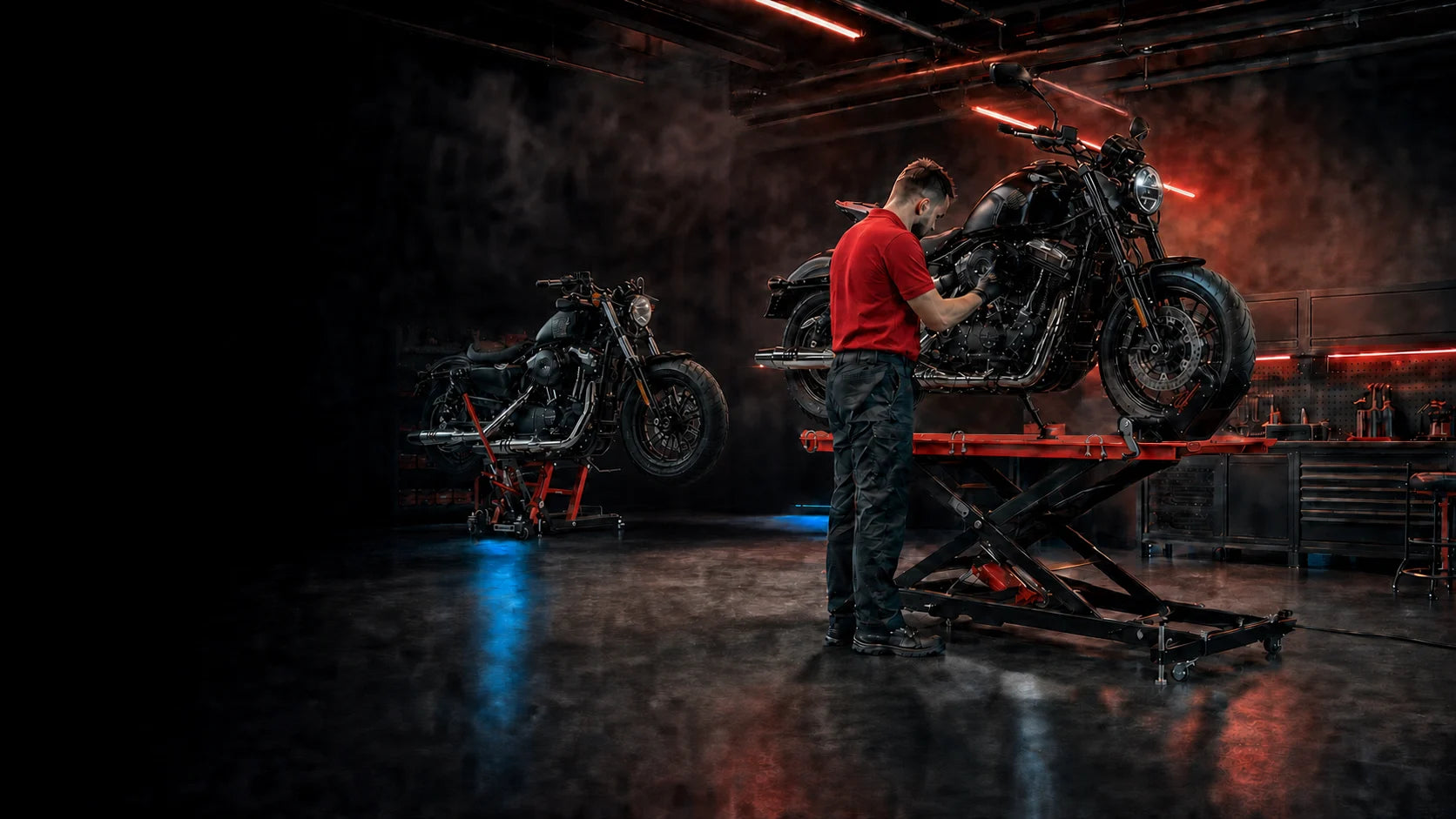 Motorcycles being serviced on hydraulic workshop lifts